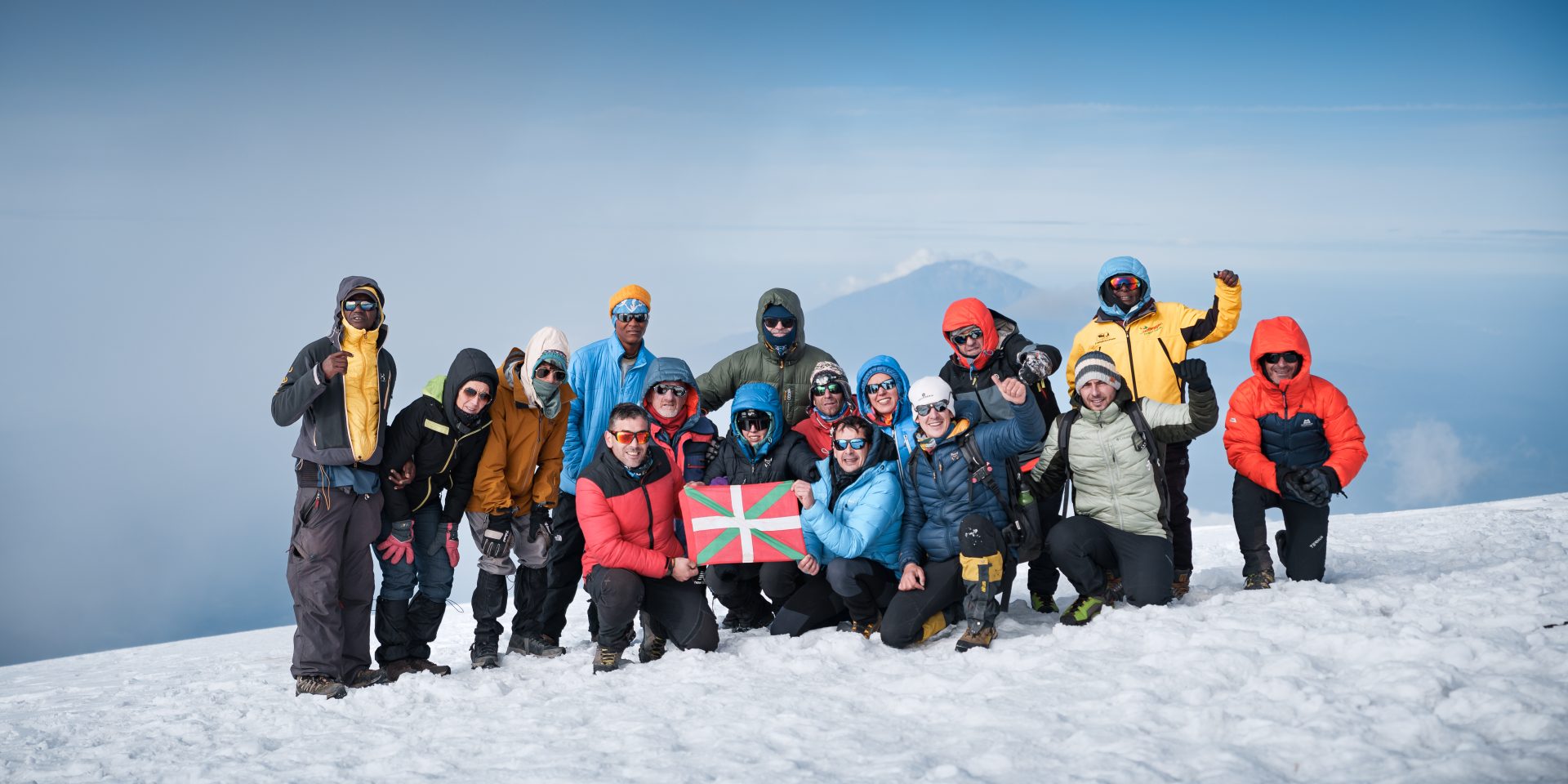 Big Group of hikers at the summit of Mt.Kilimanjaro-Uhuru Peak-Mallya Tours